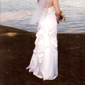 Size 4 wedding dress. Has a beautiful train that bustles up magnificently!